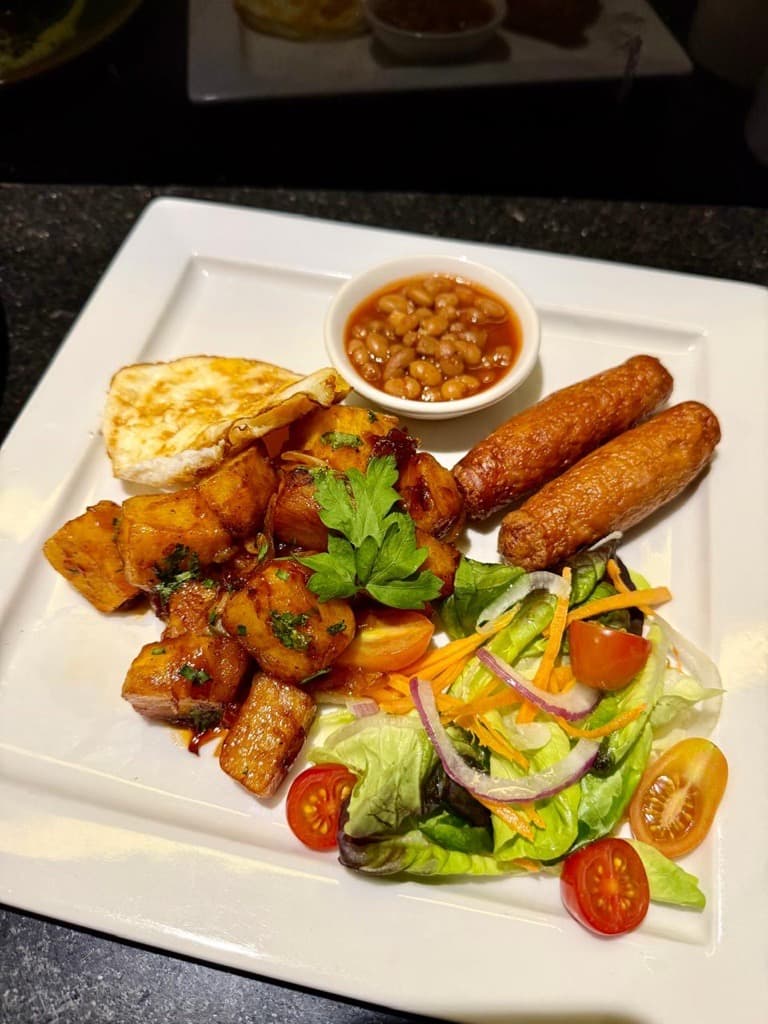 Fresh breakfast buffet spread with fruits, pastries and coffee